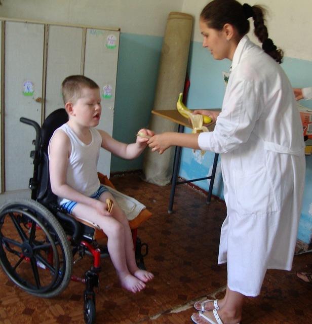 Gala feeds this boy a banana