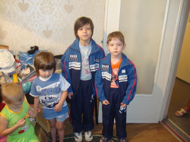 Two of the 70 children in their sweat suits.