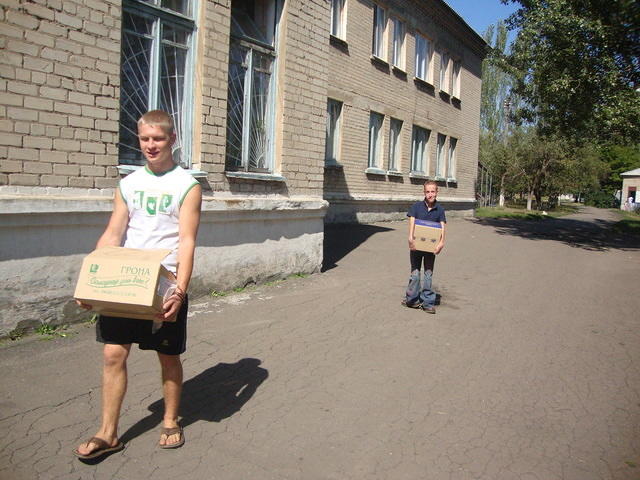 Vanya and Artum carry bananas and cookies.