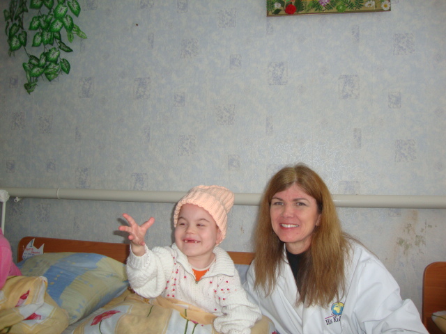 Vika loved her new hat, thanks to H. Little.
