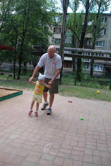 Ted walking with this visually impaired girl.