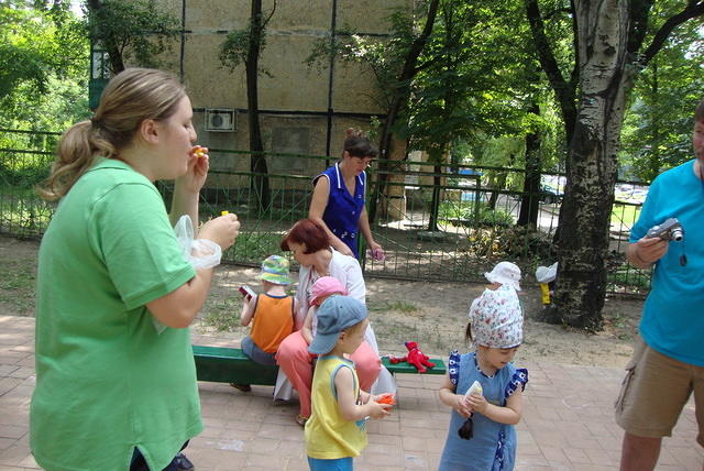 Melissa blows bubbles for the kids.