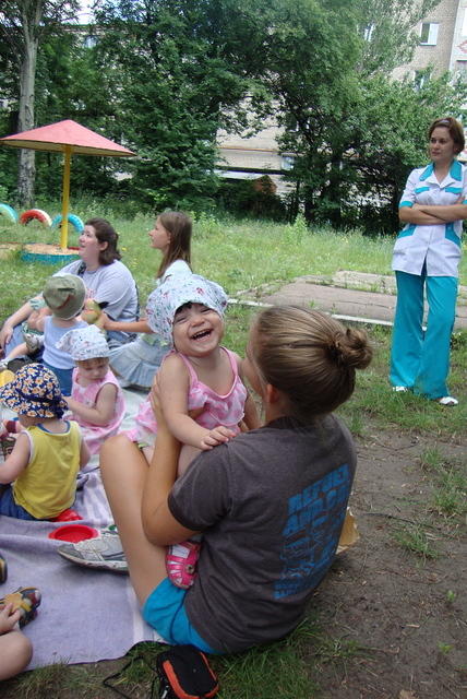 Angelina gets this little girl laughing.