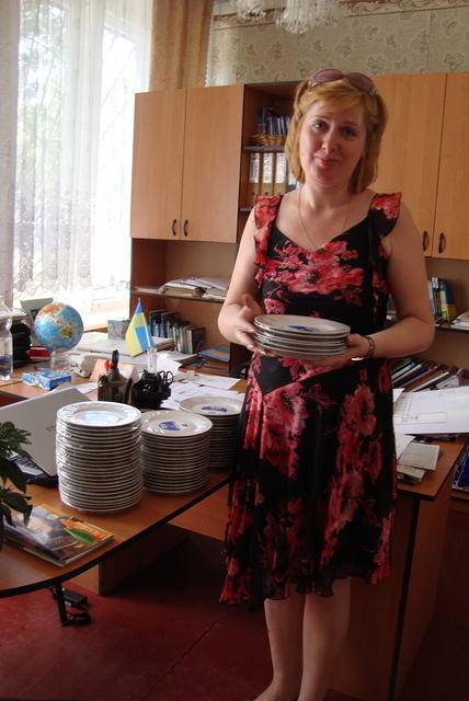 Internot director and the new plates for the facility.