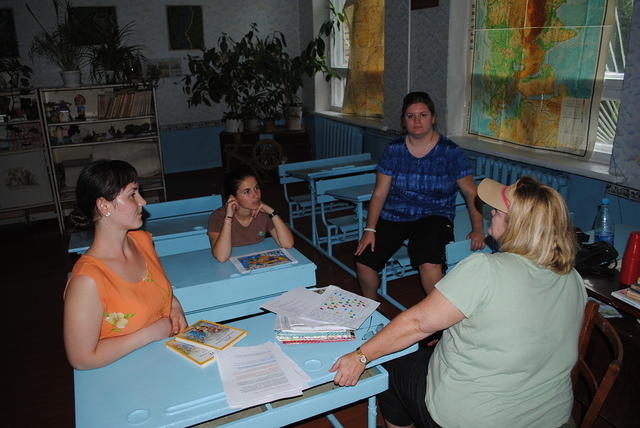 Phyllis goes over lesson plans with her classroom team