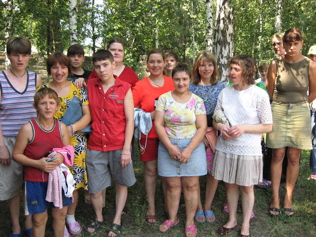 Older girls come out to get clothing.