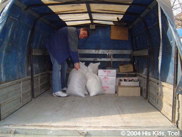 Vanya loads grain at the market
