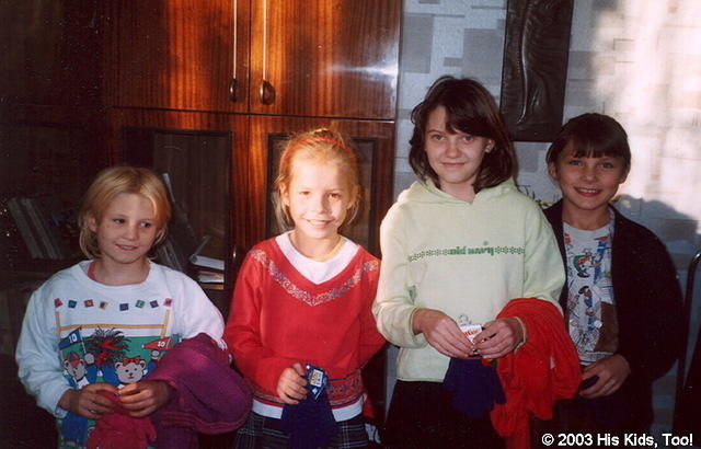 These 4 girls, are happy with their new clothing and gifts.