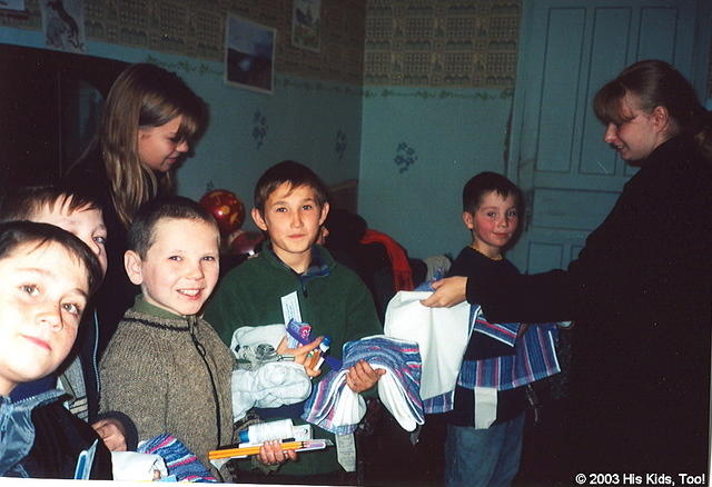 His Kids, Too! volunteer Christina helps passout the many donations that His Kids, Too! was able to provide these orphans.  Each