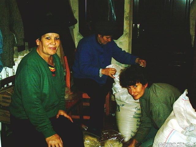 Volunteers separate pasta into 30 bags.