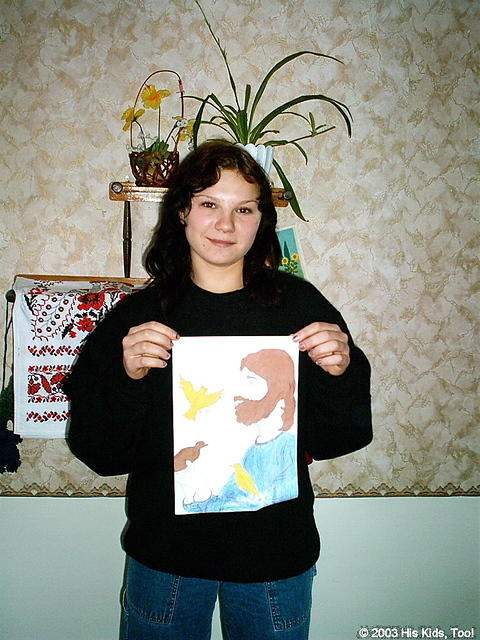 This young lady was inspired to draw Jesus with a dove!