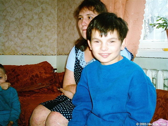Sergey shows his joy for his new warm cothing.