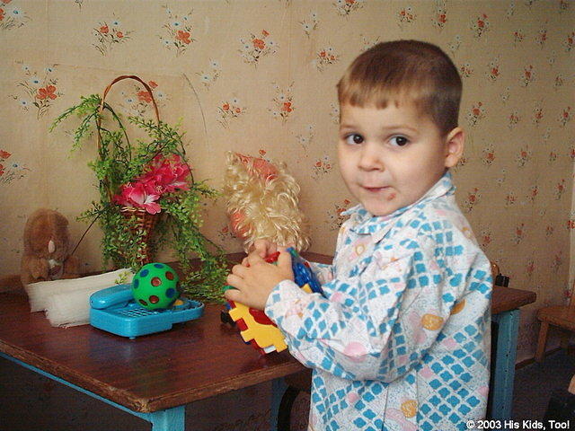 This little boy loves his new toys.