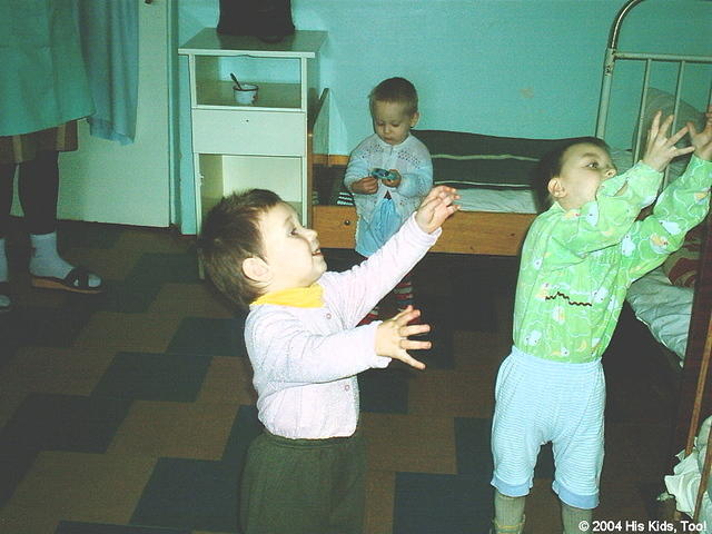 Here the children are playing catch with a soft ball that allows for indoor play, since they can not go outside.