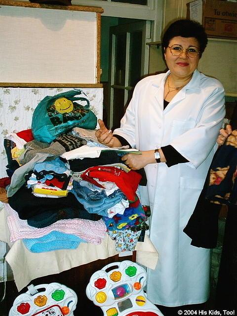 Here the director of the orphanage is pictured with some of the donations provided by His Kids, Too!  We continue the diaper and