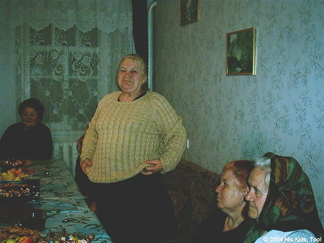 This woman is very happy with her new warm sweater.