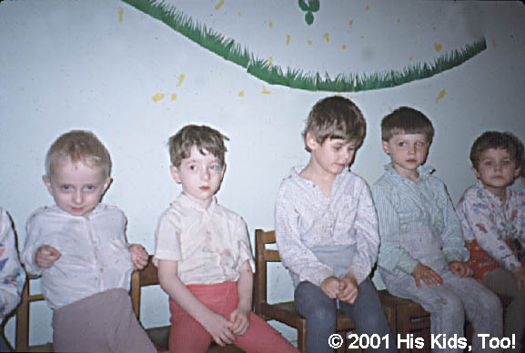 These children, all patients at a local children's orthopedic hospital, await dinner.