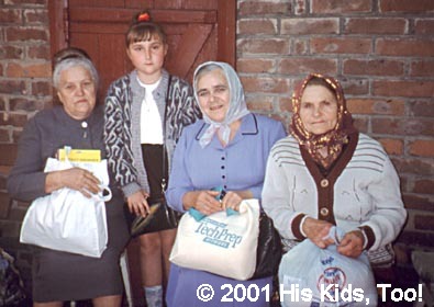 These three ladies were pleased at receiving a food bag.