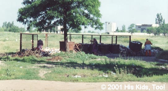 Summer01_34Widows pick through the trash to find food or items to sell to purchase food