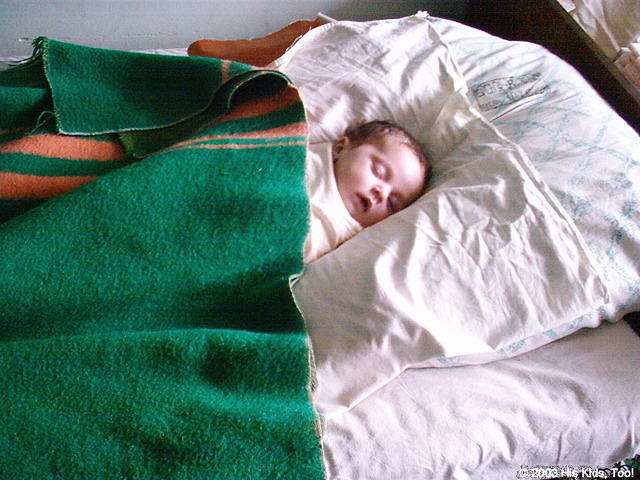 This baby lacks...a crib.