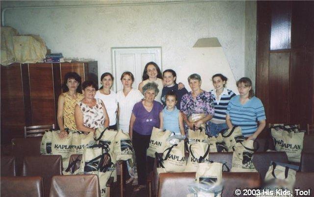Group of volunteers and the completed bags.