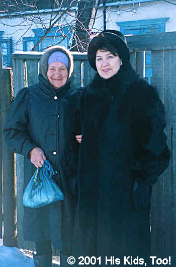 This sister hand delivers a food baskets to a local widow.