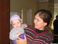 His Kids, Too! director holds this boy with his new hat and pants.
