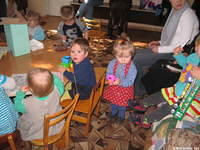 The kids are enjoying their color books, toys, and playing with chestnuts!