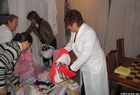 The assistant director looks through donations.