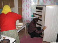 Here, His Kids, Too! director cleans the refrig.
