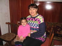 Nadia and her granddaughter Sveta. Nadia , a young widow due to Chernobyl, has serious medical issues and is in constant pain.