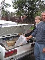 Yuri and Christina begin to unload the food which will be late be seperate