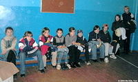 Here the older girls receive their clothing and gifts.