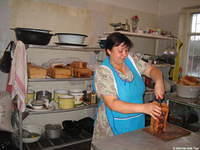 This facility grows a portion of their vegetables, has goats, and a cow, and bakes all their own bread.  The kitchen is not atta