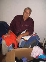 Sorting mounds of clothing can be quite tiring.  Walter Lee takes a break.