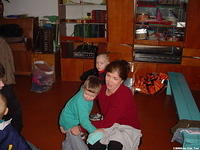 His Kids, Too! director, Teresa Fillmon, works on clothing all the children.