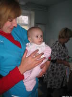 Sveta, hospital assistant director, enjoys giving us a look at the babies.