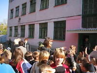 After, in the street, kids crowded around Peggy...