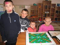 Boys enjoy a board game.