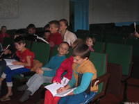 Children answer questions after the lesson.