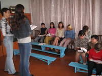 Masha and Vita teach the Bible lesson.