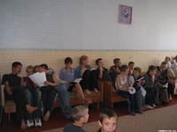 Children listen attentively to the Bible story.