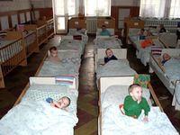 Beds and beds of children.  This is NOT rest time, these children are bed ridden.