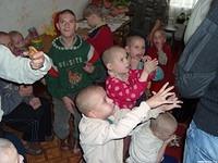 Children anxiously await cookies and bananas.