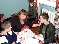 Erin does not allow a language barrier to keep her from interacting with the kids.