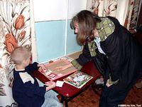 Peggy asks Artum about his art work.