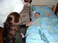 Three of the ladies are completely bed ridden.  Here, Teresa spends some time with this 22yr. old woman.