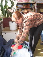 Teresa sorts age appropriate clothes for the group.