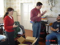 Our newest board member, Denis and Teresa sort clothing, preparing for distribution.