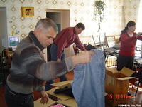 Volunteer Yuri helps sort clothing.
